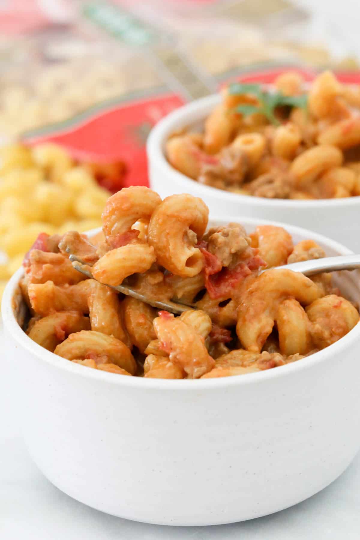 Two white bowls filled with Taco pasta.