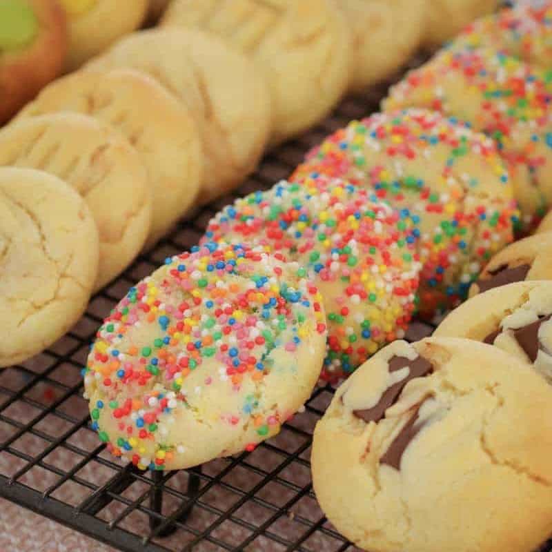 A tray lined with multiple cookies in different flavours.