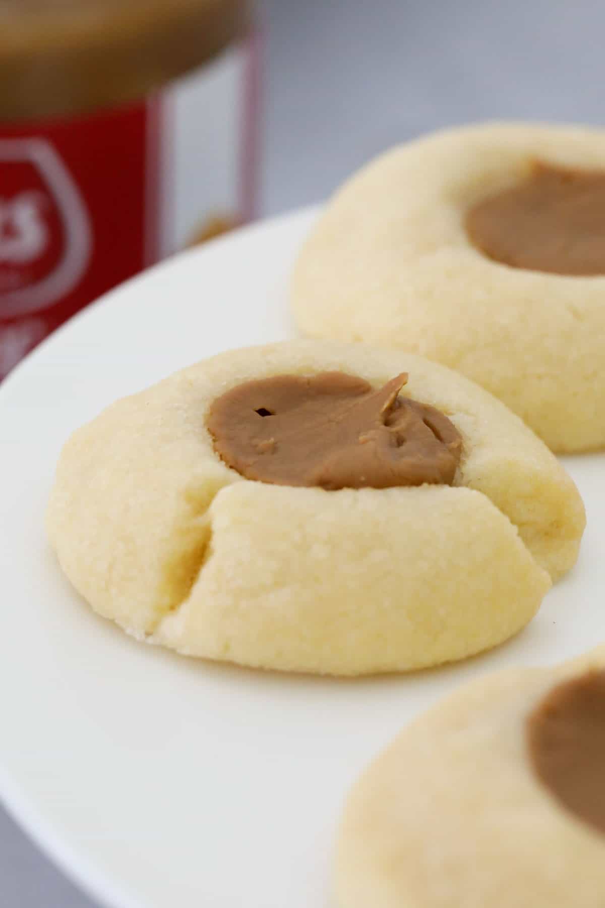 Biscoff Thumbprint Cookies served on a cake tray.