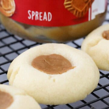 Thumbprint biscuits cooling on a wire tray.