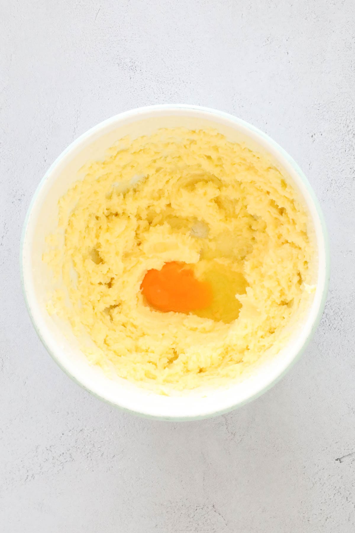 An egg added to creamed mixture.