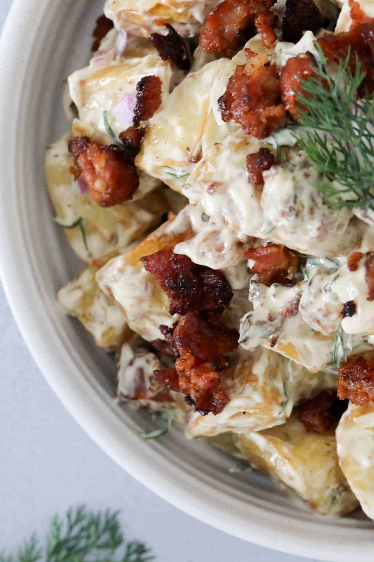 Looking down on a creamy potato salad in a bowl.