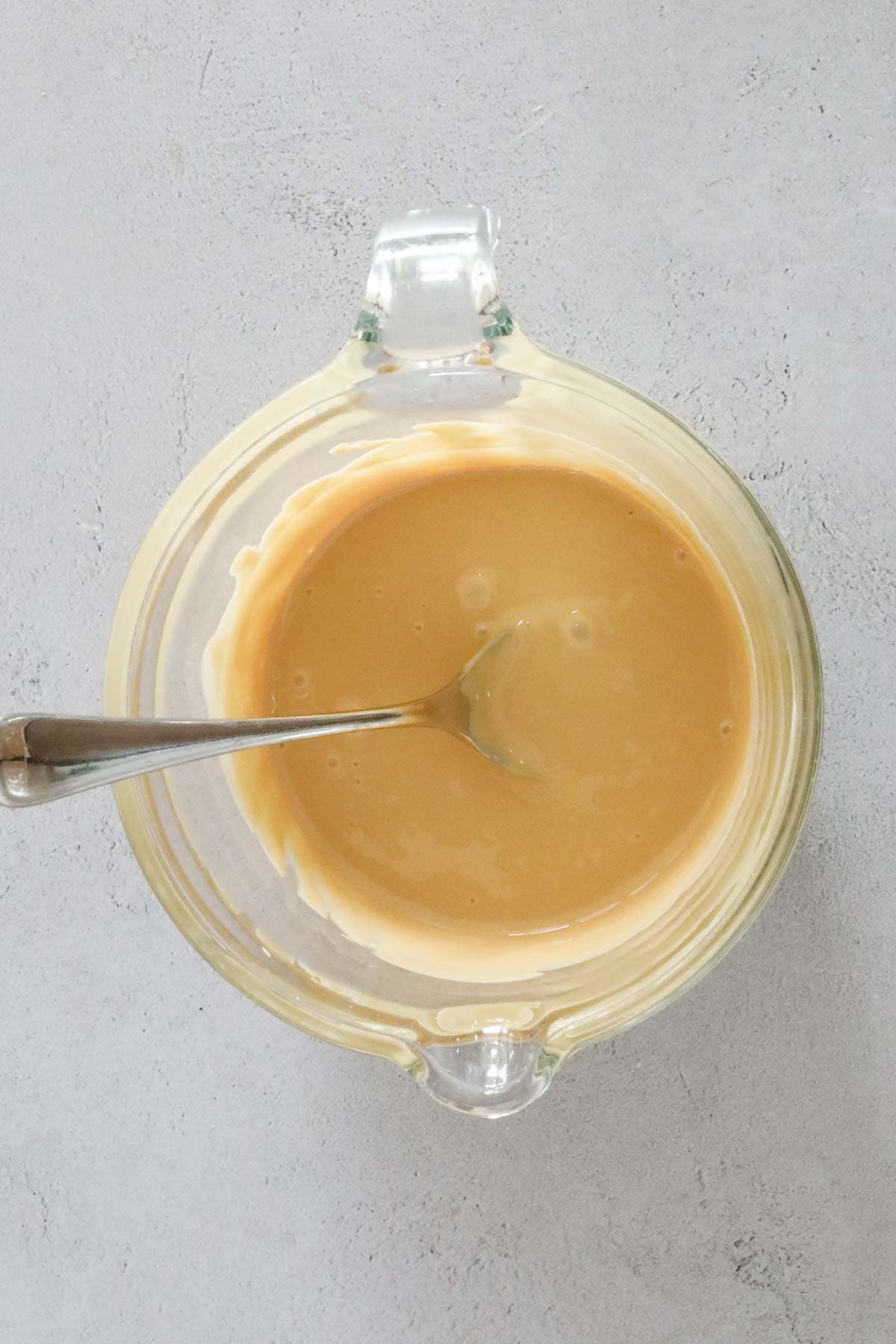Caramiilk chocolate melted in a bowl.