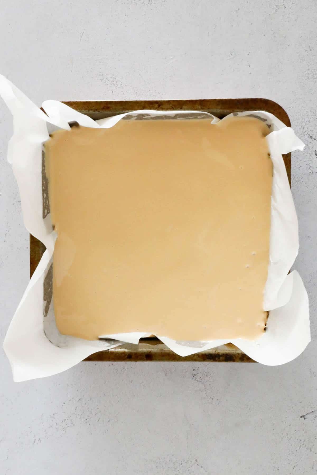 Caramilk chocolate spread over the biscuit base.