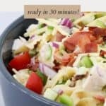 Extra crispy bacon and grated cheese sprinkled over chicken pasta ranch salad.