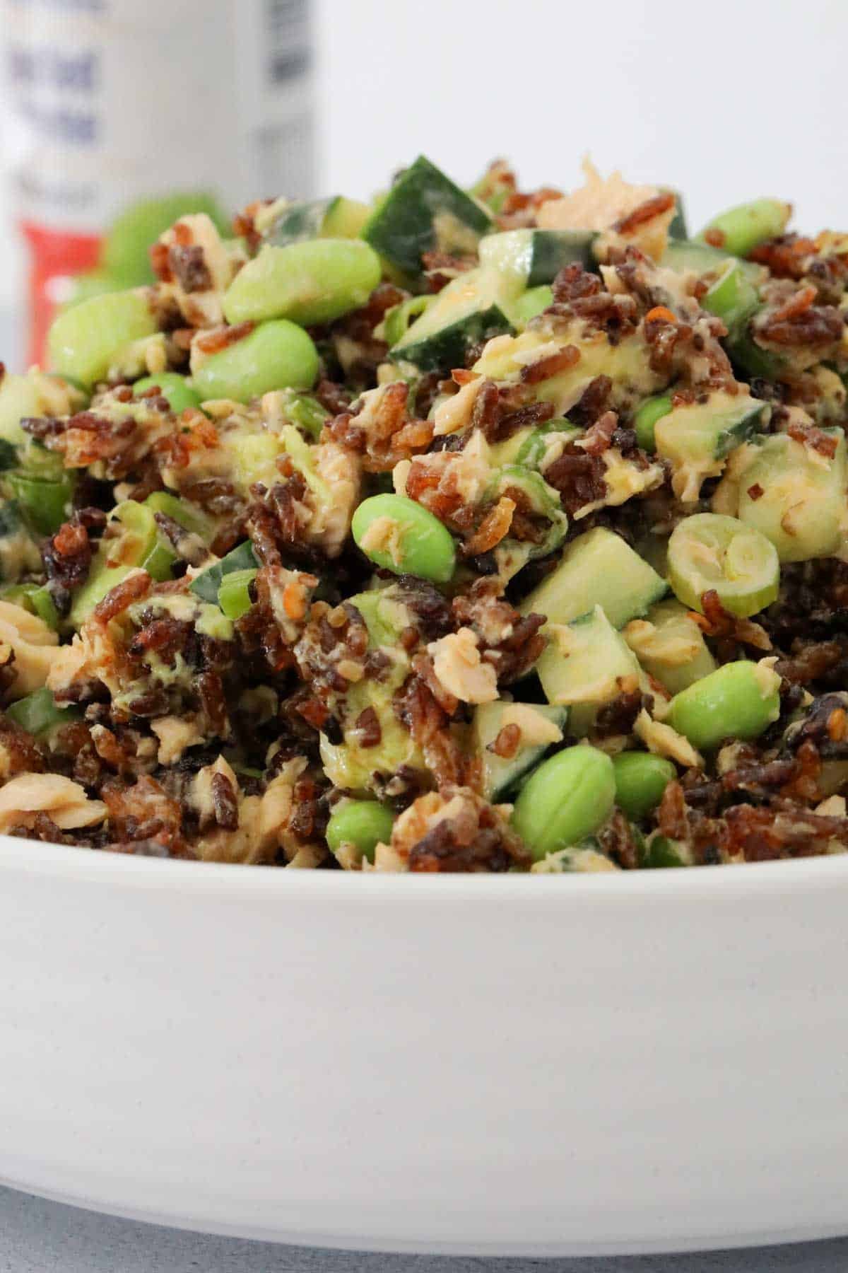 Salmon, rice, edamame and avocado salad in a bowl.