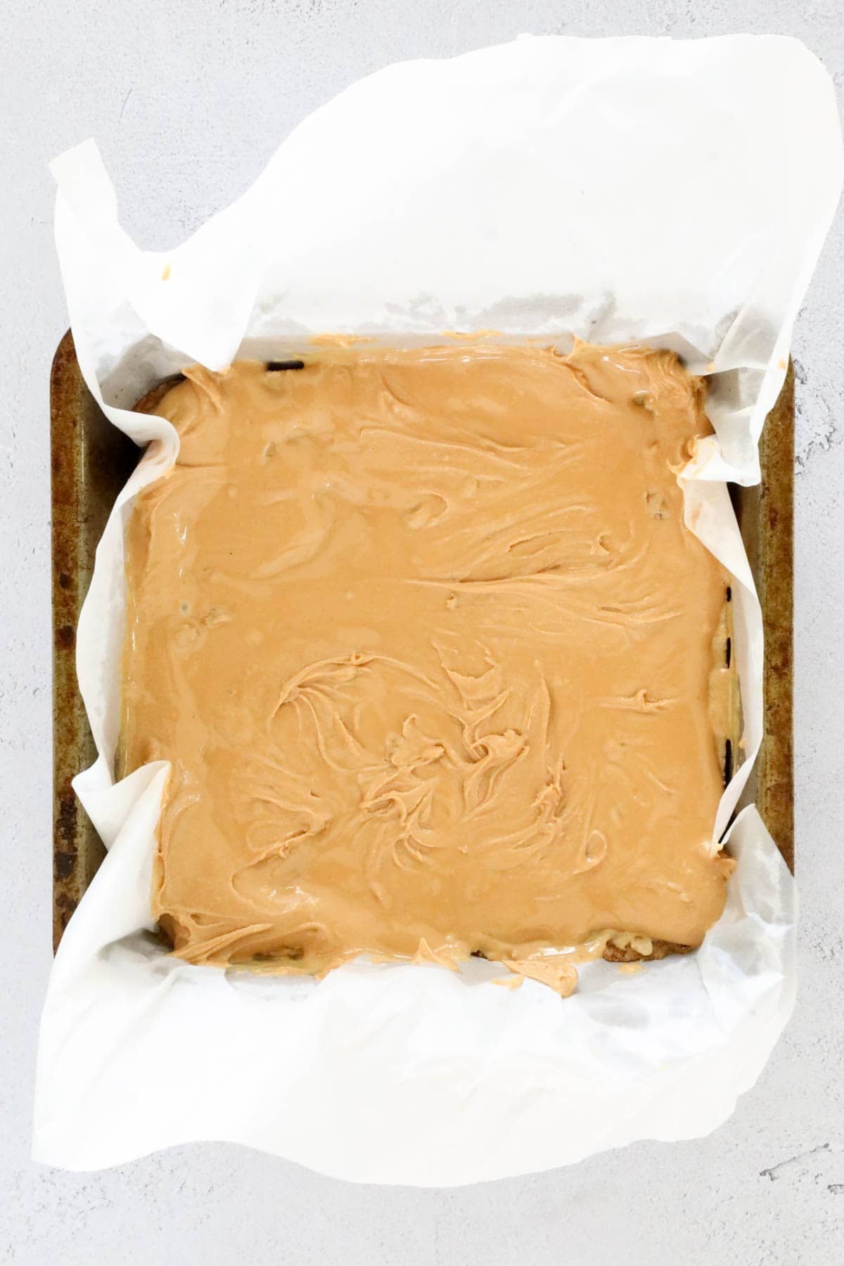 Peanut butter in a square tin.