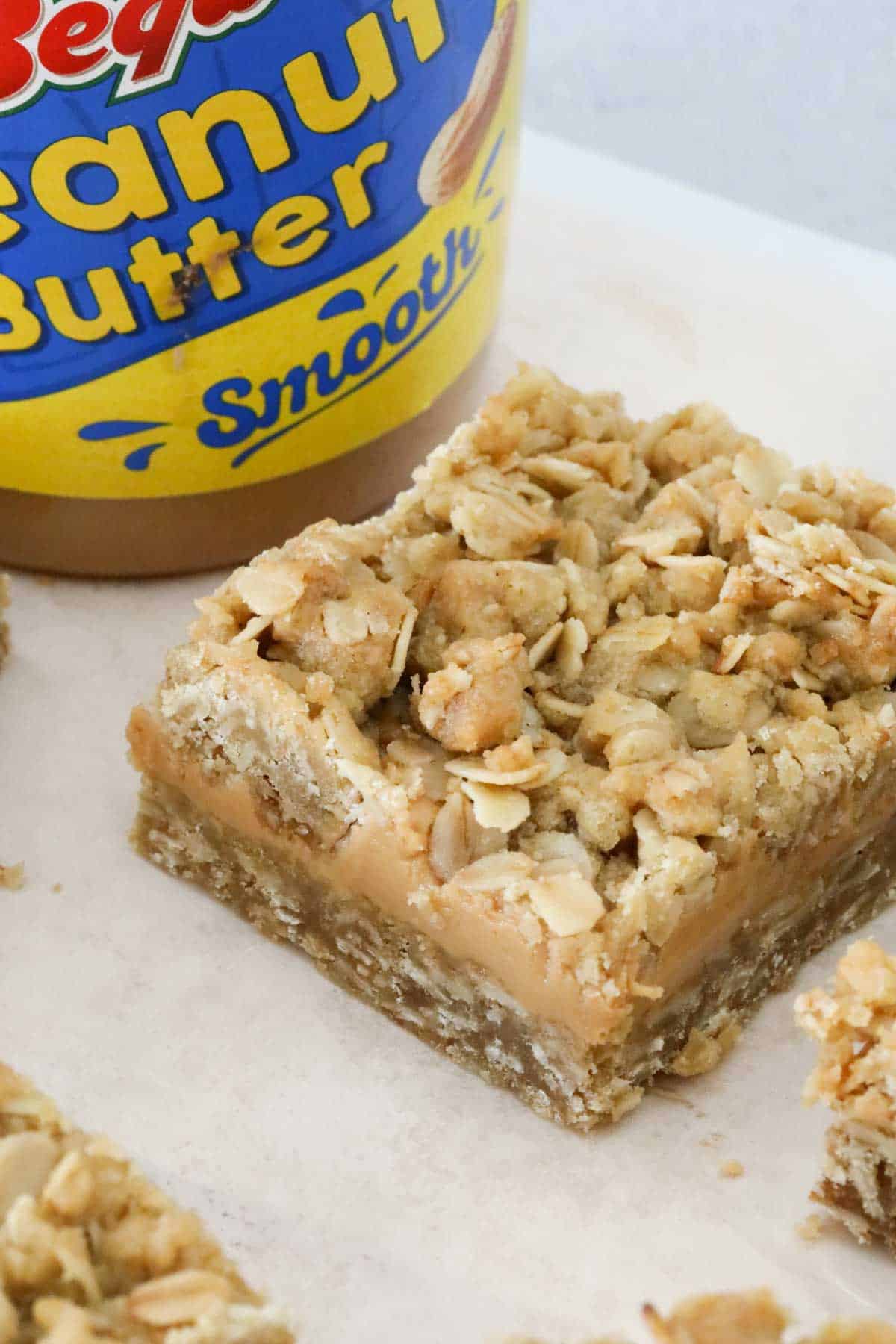 Oatmeal peanut butter slices on a chopping board.