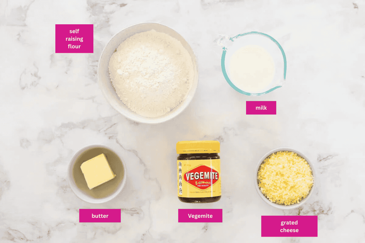 The ingredients for cheese and vegemite scrolls in small bowls.