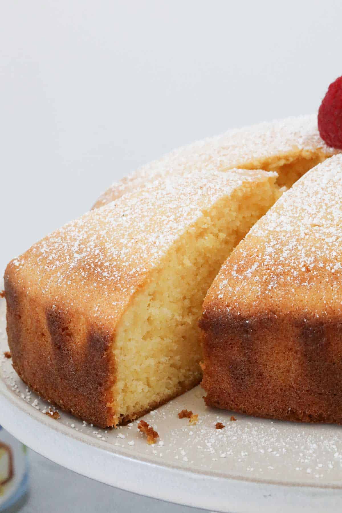 A piece of cake being removed from the whole cake.
