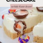 A white chocolate cheesecake loaded with Creme Eggs, with a slice cut and slightly removed.