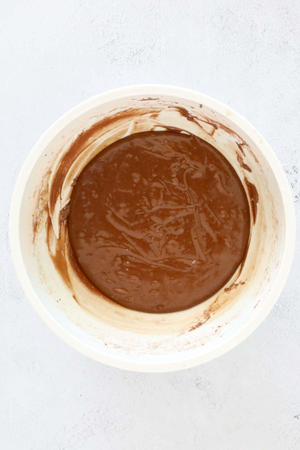 The cookie batter mixture in a large white bowl.