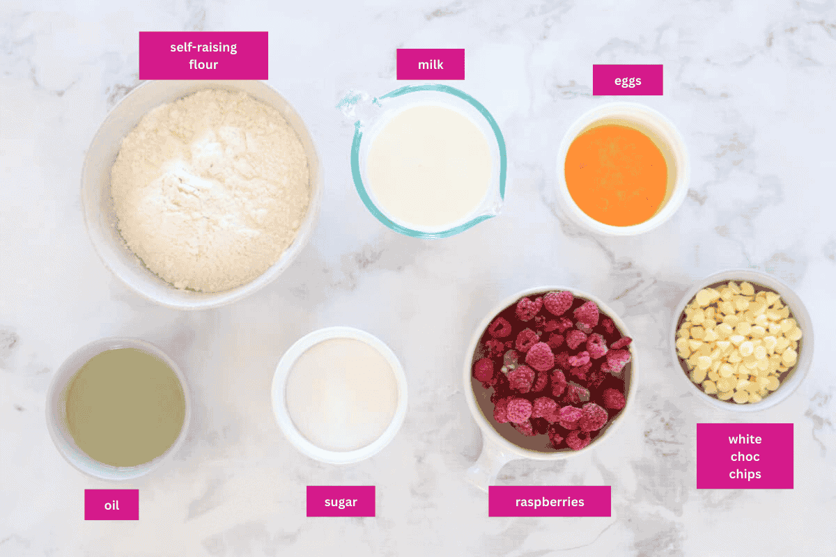 The ingredients for White Chocolate And Raspberry Muffins in small bowls.