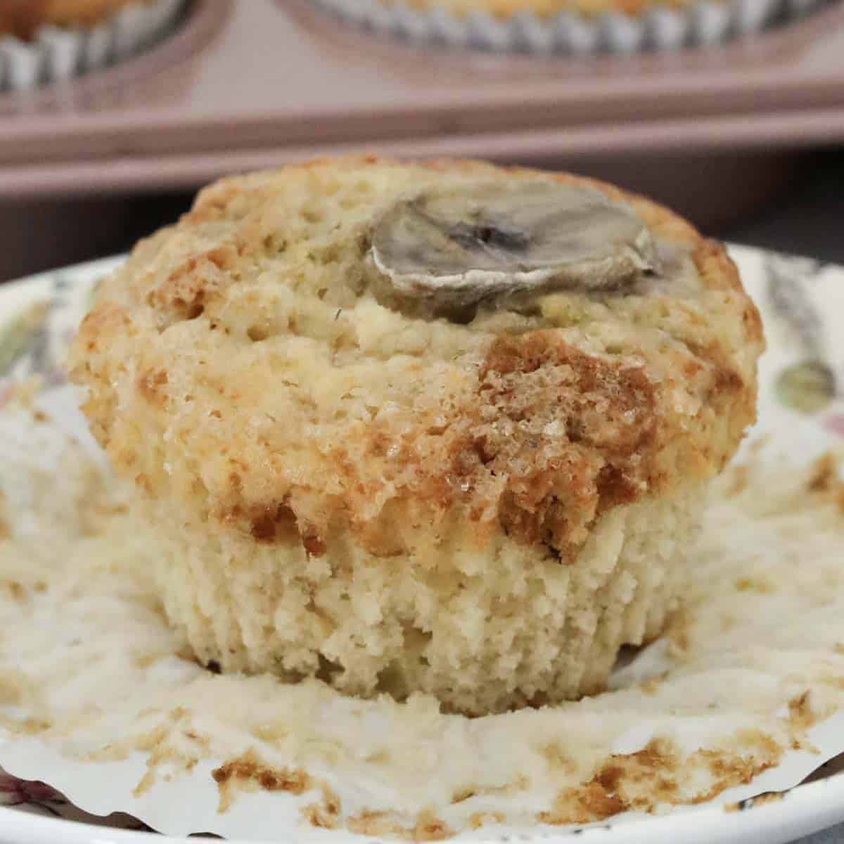 A moist banana muffin removed from it's paper case.