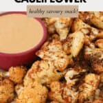 A plate of crispy cauliflower with a bowl of spicy dipping sauce.