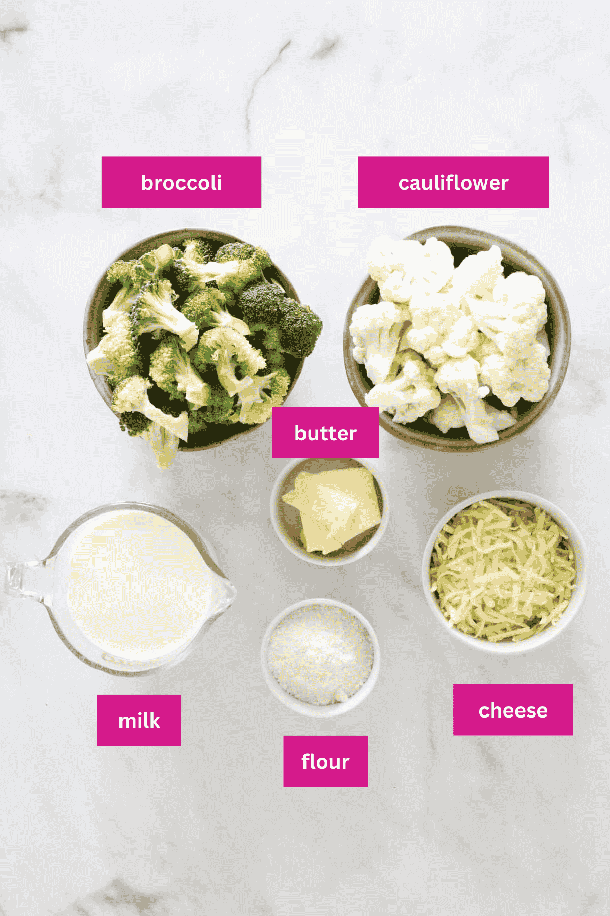 The ingredients for cauliflower and broccoli cheese bake in bowls.